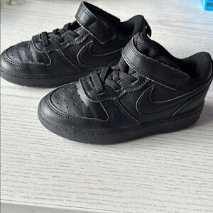 Nike Black Low-Top Sneakers with Swoosh Logo